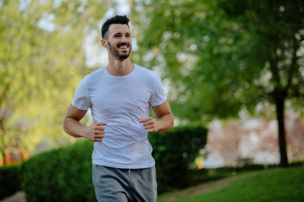 istock Young sportsman running outdoors 889201110