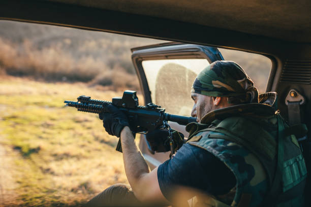 istock Soldier in back of vehicle 889201548