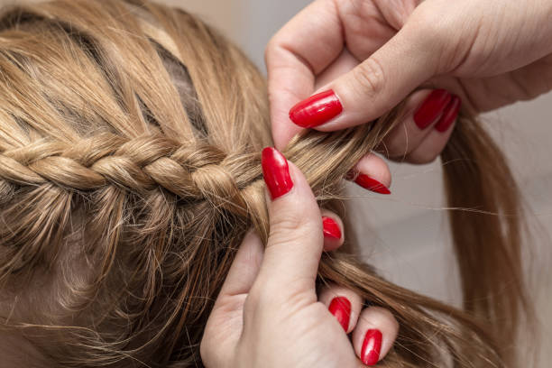istock braided pigtails in the beauty salon 889204280