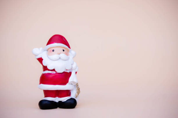 istock santa claus doll christmas background and gift box and copy space 889209106