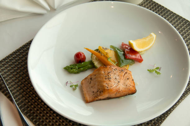 istock Fresh grilled salmon steak slices and sauce 889223406