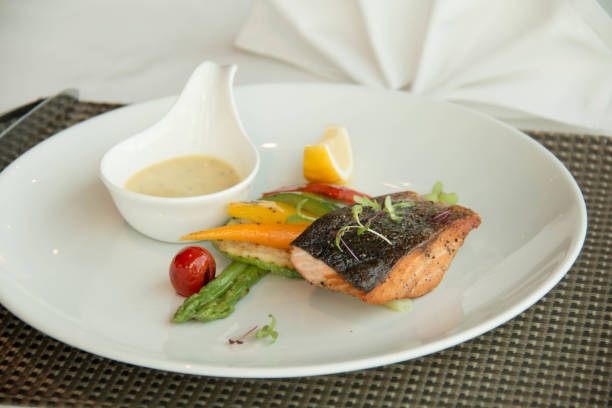 istock Fresh grilled salmon steak slices and sauce 889225760