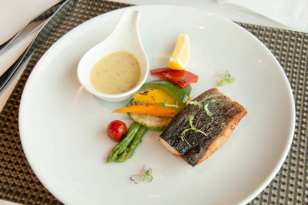 istock Fresh grilled salmon steak slices and sauce 889225806