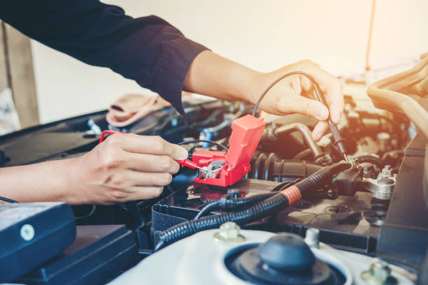 istock Hands check battery car mechanic working in auto repair service 889226026