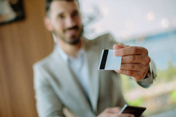 istock Busninessman paying bill by card 889226140