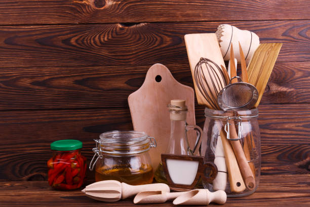 istock Many different kitchen utensils made of wood and different products. 889230982