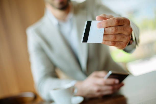 istock Busninessman paying bill by card 889231098