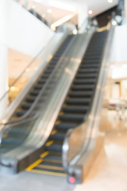 istock Blur escalator transportation speed  with bokeh 889231408