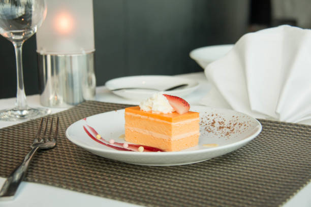 istock Orange Sponge Cake on a white plate 889234410