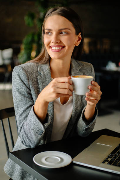 istock Young business woman drinking coffee 889250050