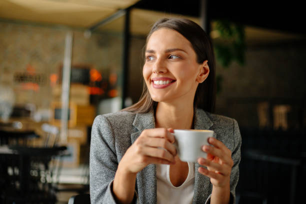 istock Young business woman drinking coffee 889253090