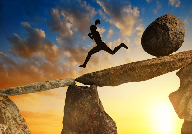 istock The tourist running away from big stone. 889283880