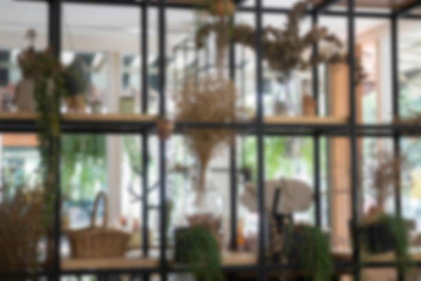 istock Multiple green plant pots display on shelve 889286374
