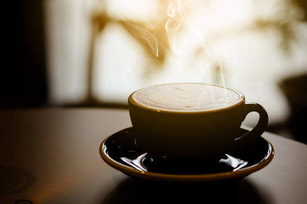 istock Hot coffee in black cup on the table 889286510