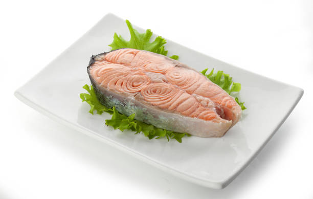 istock Steak of salmon with fresh lettuce 889291654