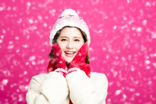 Young Beautiful Woman with winter snow background