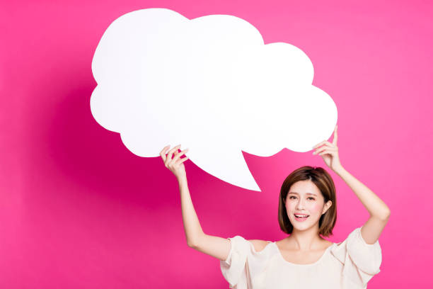 istock happy young woman showing dialog signs 889296884