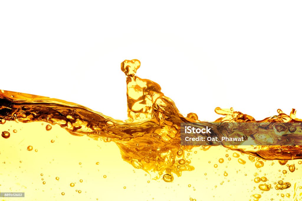 Liquid gold drop and ripple ,abstract background Cooking Oil Stock Photo