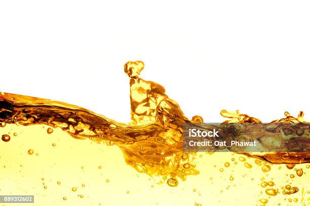 Liquid Gold Drop And Ripple Abstract Background Stock Photo - Download Image Now - Cooking Oil, Soybean, Bran