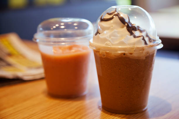 istock Chocolate milkshake with whipped cream on table 889318048