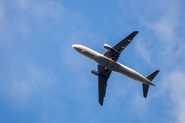 istock Big passenger plane in the sky. View from the bottom 889320416