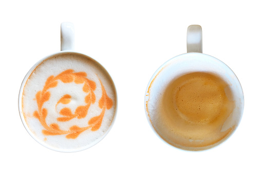Top view of white cup of Thai orange tea with latte art milk foam surface before and after drink isolated on white background