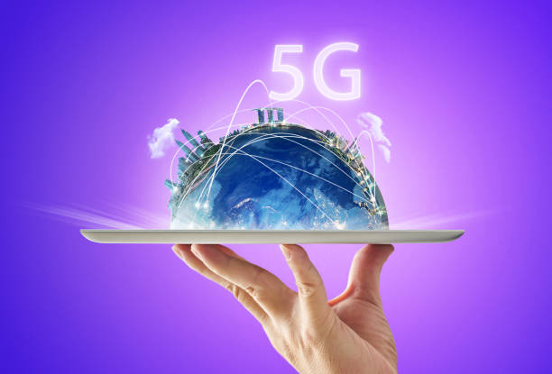 istock Waiter hand holding an empty digital tablet with smart city and 5G network wireless systems and internet of things . 889321380