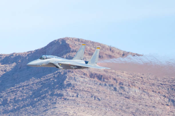 istock F-15 Eagle against the Nevada hills, with afterburner on 889349548