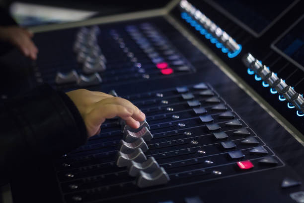 istock Close up of child adjusting volume on audio mixer. 889398366