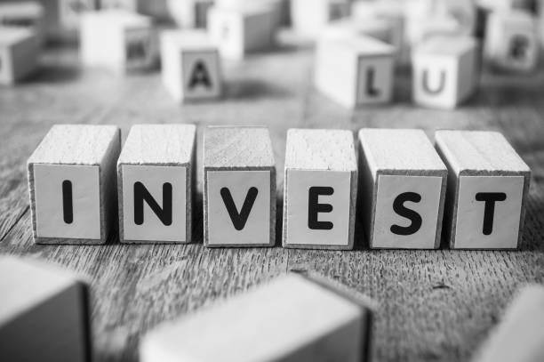 istock concept word forming with cube - Invest 889404966