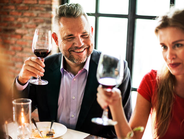 istock Friends at a dinner party 889405322
