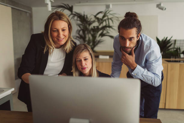 istock Businesspeople Working Together In The Modern Office 889405900
