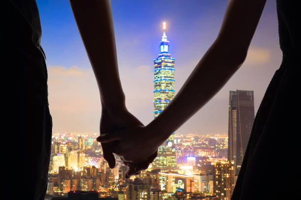 silhouette of couple with night taipei city panorama in the taiwan