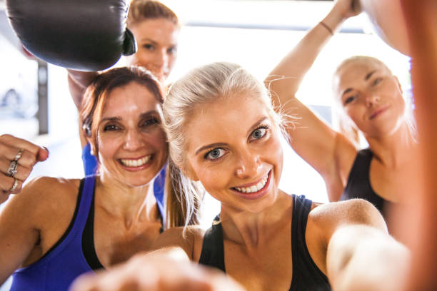 istock Fitness friends having a break with selfie post workout 889409860