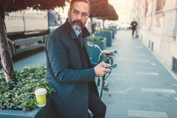 istock Businessman going on or off to work on bicycle 889417764