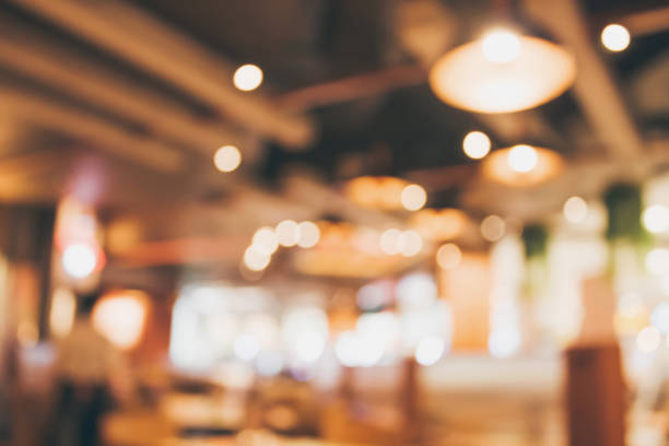 istock Restaurant cafe or coffee shop interior with people abstract blur background 889418008