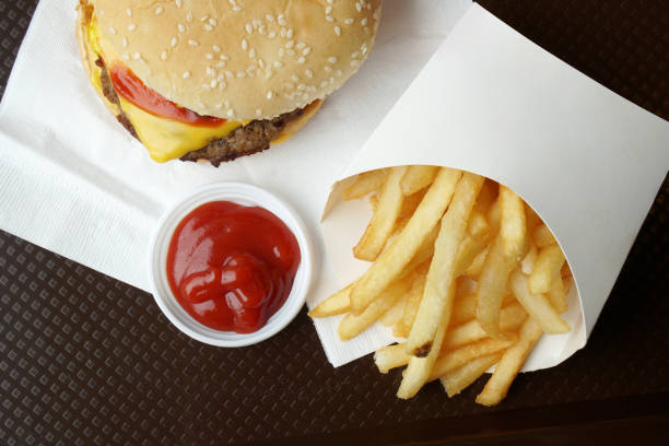 istock Cheeseburger and french fries 889421240