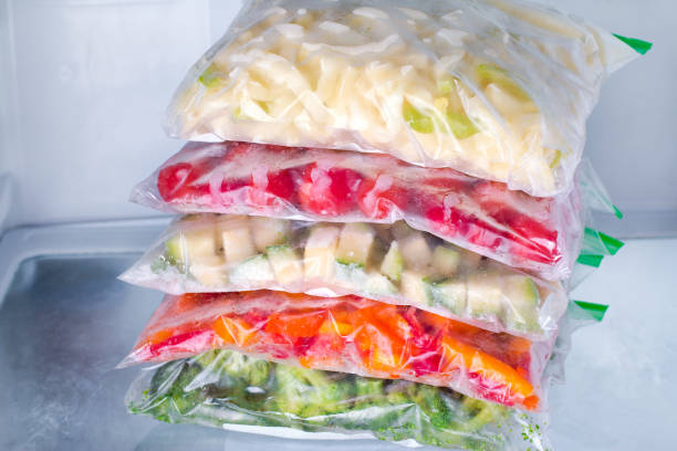 istock Frozen vegetables in bags in refrigerator. Freezing. 889421654