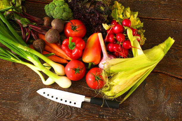 istock salad from fresh vegetables in a plate on a table, selective focus 889422148