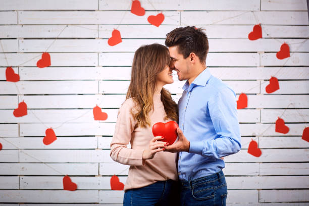 istock A loving couple hugs with a heart in their hands. 889445940