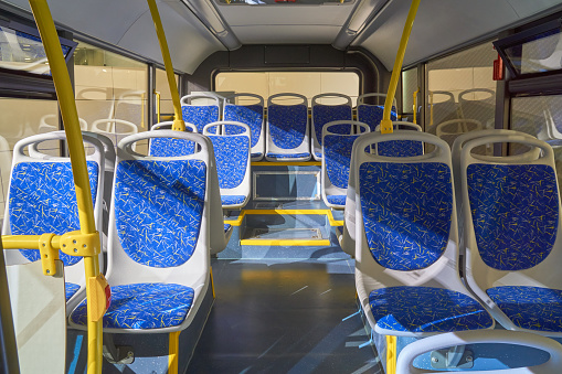 Interior of modern bus with passenger seats