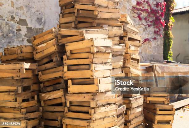 Close Up Of Wooden Barrels And Crates Stock Photo - Download Image Now - Agriculture, Barrel, Box - Container