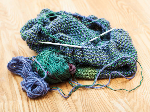 istock knitting materials on wooden table 889454192