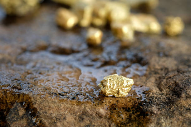 istock The pure gold ore found in the mine on a stone floor 889454376