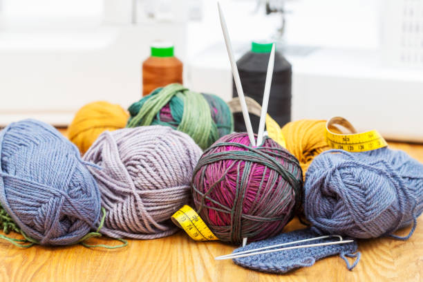 istock knitting materials on table and sewing machines 889454714