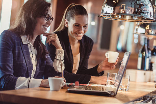 istock Businesswomen Working in The Cafeteria 889457238