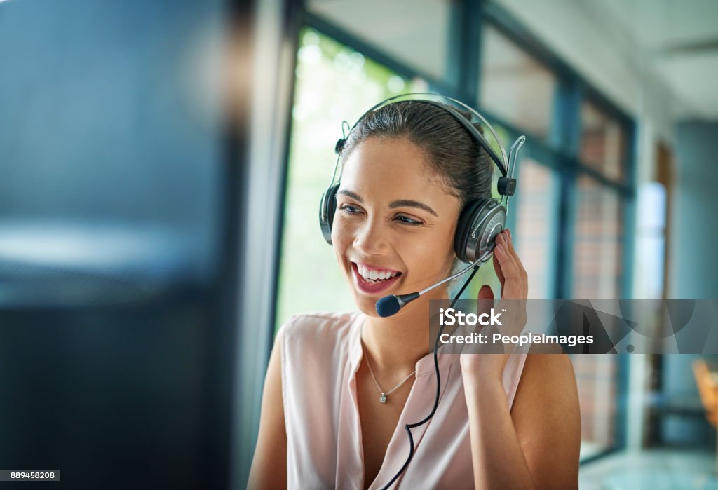 You’ve reached our support line Shot of a young woman working in a call center Customer Service Representative Stock Photo