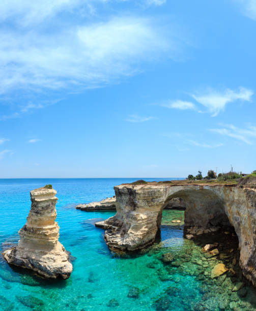 istock Faraglioni at Torre Sant Andrea, Italy 889460968