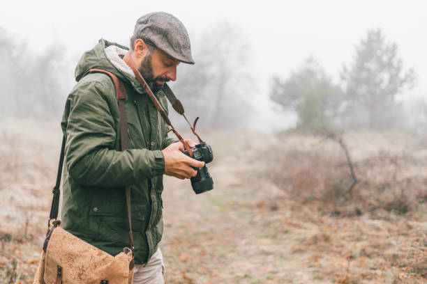 istock Photographer on a foggy mountain 889463264