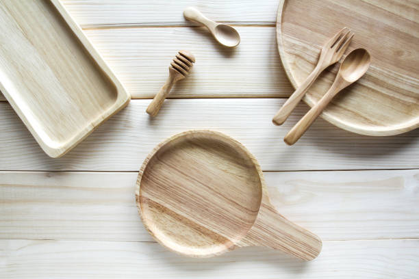istock Wooden kitchen utensils on wooden background 889463922